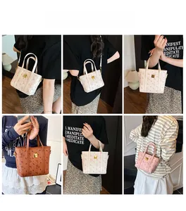 Detailed views of printed crossbody bucket bags with bear patterns and gold logo