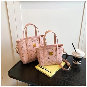 Detail view of pink tote bag set with bear print on high-quality faux leather texture