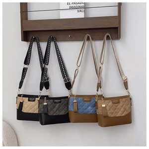 Quilted crossbody bucket bags in four color options with wide adjustable straps
