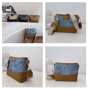 Detail of vintage quilted chain bag with wide jacquard strap and metal logo