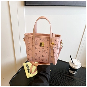 Detail of pink faux leather crossbody bag featuring cute bear prints and metallic hardware