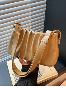 Chic pleated cloud shoulder bag in beige leather with gold zipper and wide strap