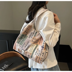 Detail of artistic Chinese calligraphy print on a thick off-white canvas tote bag