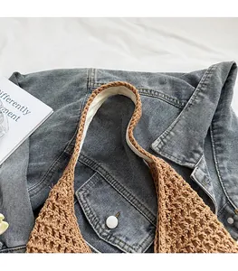 Close-up of hand-woven hollow tote bag showing brown cotton texture and comfortable straps