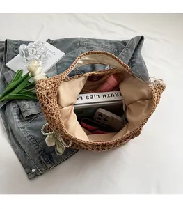 Detail of hand-woven cotton tote bag interior with storage space for books and phone