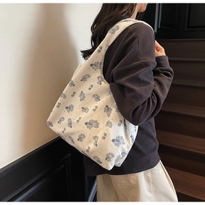Close-up of white canvas tote bag with artistic goldfish pattern and Koi printing