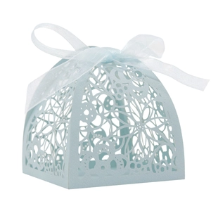 Close-up of light blue laser-cut floral favor box with a matching ribbon bow
