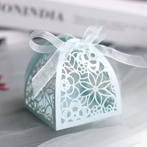 Detailed laser-cut floral pattern on light blue pearlescent paper wedding favor gift box