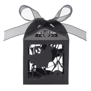 Hollow black Halloween candy box with spider web laser cut design and satin ribbon