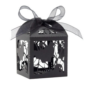 Black laser-cut Halloween candy box with spider web ghost patterns and a chiffon ribbon