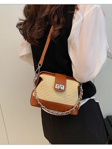 Brown patchwork straw chain bag with metal lock and leather strap shown on model