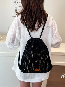 Knitted drawstring bucket backpack with hollow flower pattern for seaside beach vacations