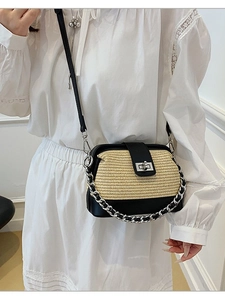 Chic straw and black leather crossbody shell bag with silver chain and clasp