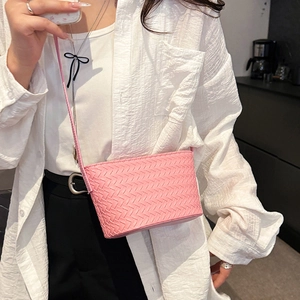 Pink woven leather crossbody bag with Intrecciato pattern and adjustable shoulder strap