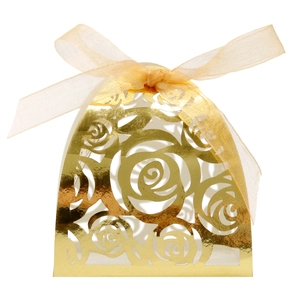 Detail of laser-cut rose hollow candy box with golden metallic finish and ribbon