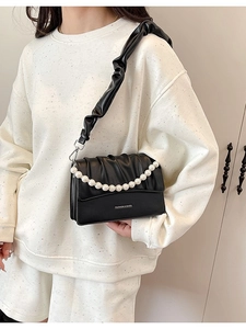 Chic black pleated shoulder bag with pearl chain and fashion lettering on smooth leather