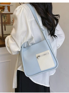 Minimalist light blue lychee pattern shoulder bag with off-white contrast zipper pocket