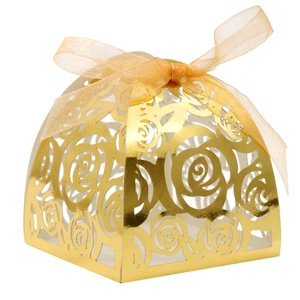Golden laser cut rose pattern wedding favor box with an elegant silk ribbon bow