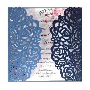 Laser cut rose wedding invitation covers in light blue and navy blue with floral inserts