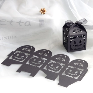 Laser cut black Halloween candy box with pumpkin and spider web designs and ribbon