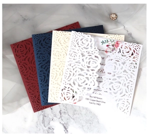 Detailed laser-cut floral wedding invitations in burgundy, navy, ivory and white cardstock