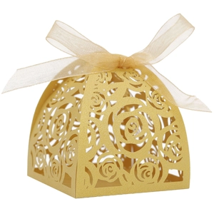 Close-up of golden laser-cut rose hollow candy box with an elegant champagne ribbon bow