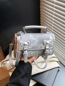 Silver marble pattern crossbody bag with top handle and bow embossed decorative straps
