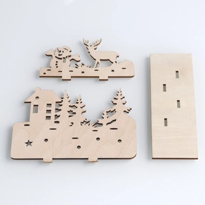 DIY laser-cut wooden Christmas ornament with snowman and reindeer for holiday decoration