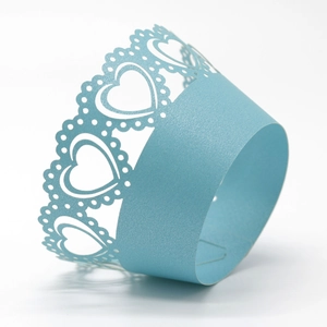 Laser cut light blue cupcake wrapper with elegant hollow heart patterns for party decor
