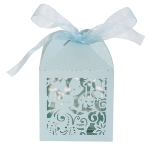 Detail view of light blue laser-cut paper gift box featuring number 18 and floral patterns