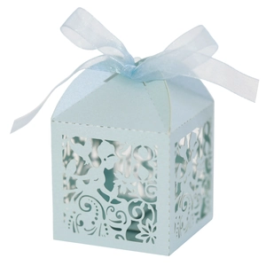 Detail of light blue laser-cut candy box with 18th birthday design and ribbon bow