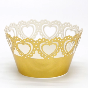 Detailed laser-cut heart pattern cupcake wrapper in glossy gold finish for party decor