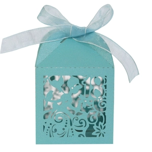 Detail of laser-cut number 18 on tiffany blue candy box with elegant ribbon bow
