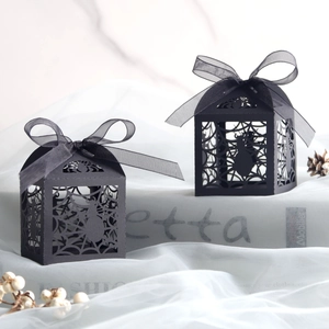 Halloween black laser-cut spider web favor boxes with elegant ribbon bows
