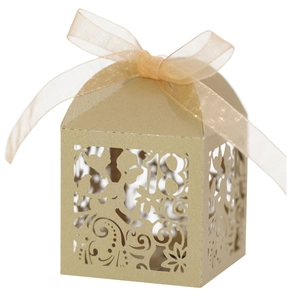 Detail of laser-cut number 18 and floral patterns on champagne gold gift box with ribbon
