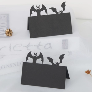 Halloween place cards with laser cut bat design and folding paper style for party tables