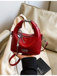 Red crocodile texture handbag with silver key charm and top handle for women