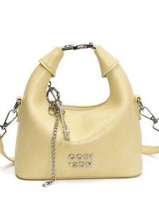 Light yellow crocodile pattern dumpling bag with silver COIH logo and chain detail