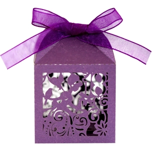 Detail of laser-cut fairy and number 18 on dark purple gift box with organza ribbon
