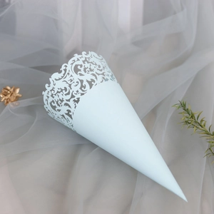 Detail of light blue laser-cut lace cone for wedding petals on elegant mesh background
