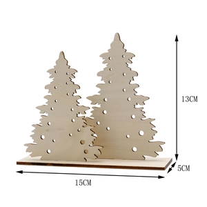 Detailed view of the 15x13cm laser-cut wooden Christmas tree ornament on base
