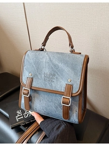 Retro denim and brown leather satchel bag with top handle and adjustable shoulder strap