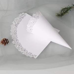 Detailed laser-cut lace wedding confetti cone with elegant white rose floral pattern