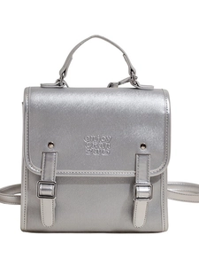 Silver metallic retro backpack with top handle and decorative buckle straps for women