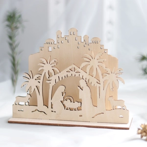 Laser cut wooden nativity scene featuring Joseph, Mary and baby Jesus with palm trees