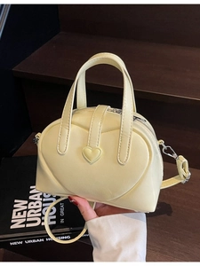 Fashionable light yellow Boston bag with 3D heart design and adjustable strap for women