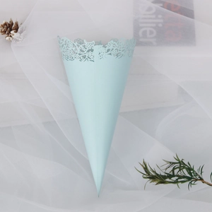 Detail of light blue laser-cut cone with floral pattern for wedding confetti and petals