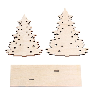 Macro detail of laser-cut wooden Christmas tree DIY kit pieces with natural finish