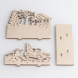 Laser-cut wooden Christmas decor set featuring a 3D snowman, pickup truck and festive scene