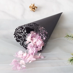 Elegant black laser-cut confetti cone with intricate vine patterns for wedding celebrations